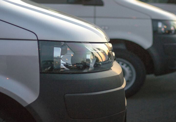 Fleet of light commercial vehicles focusing on road safety and control, highlighting the importance of managing vehicle risks effectively.