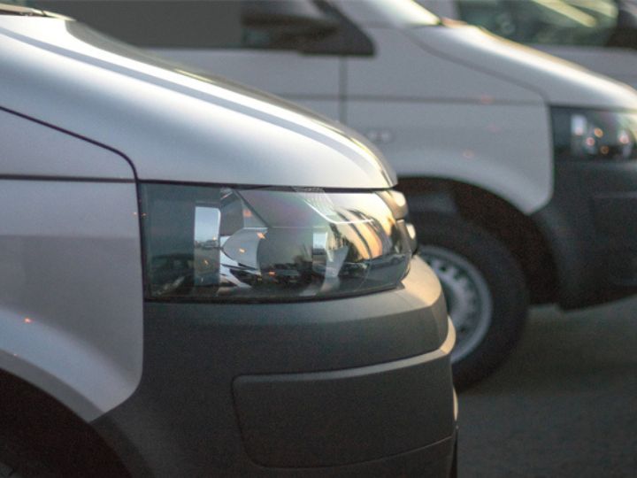 Fleet of light commercial vehicles focusing on road safety and control, highlighting the importance of managing vehicle risks effectively.