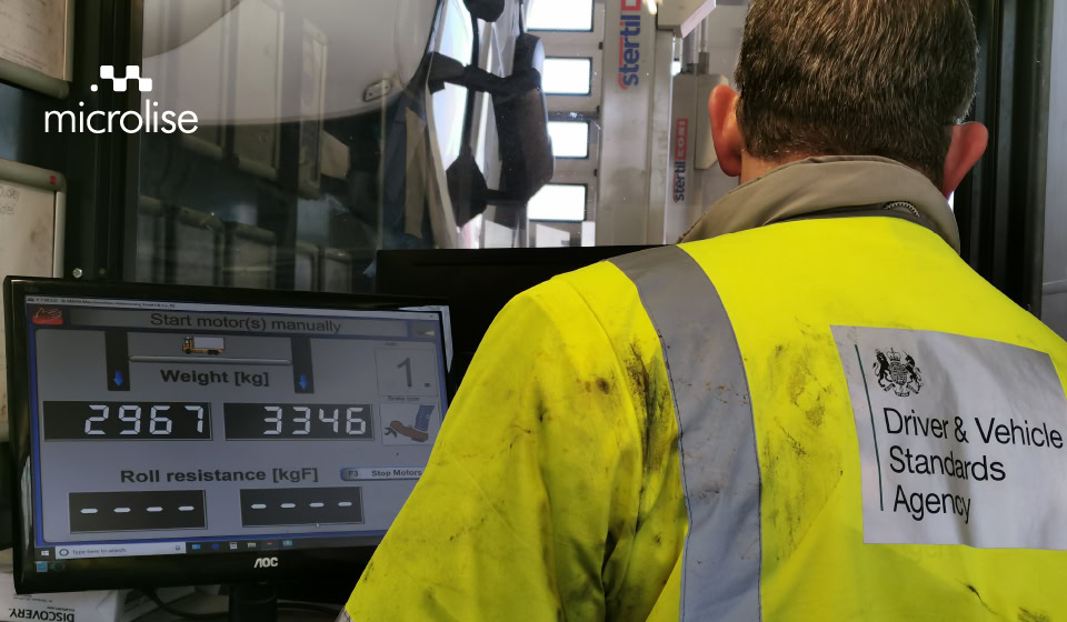 a mechanic operating an electronic brake performance monitoring system