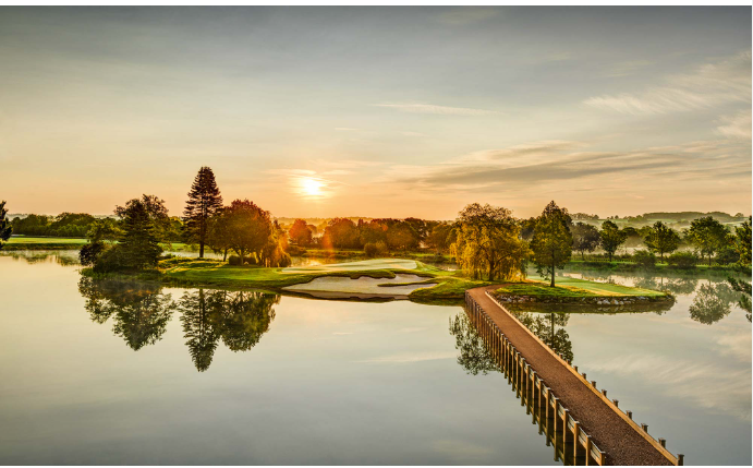 Microlise logistics and fleet management technology at sunset over a scenic river landscape.