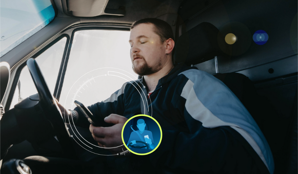 man using phone while driving