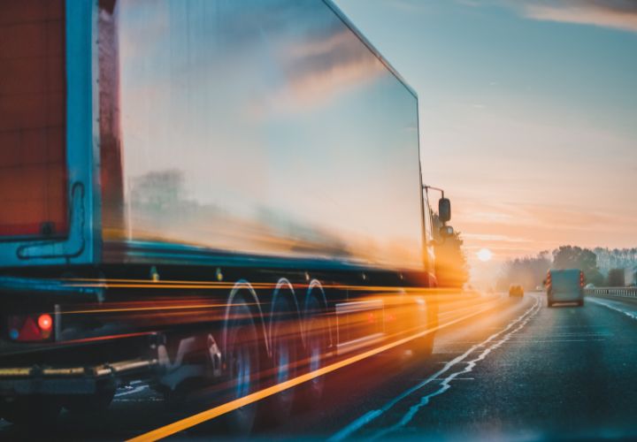 lorry and van driving on road