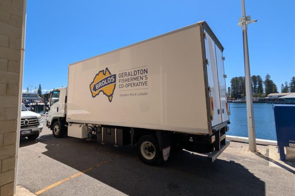Geraldton Fishermen’s Co-operative Delivery Truck Efficient fleet management truck with Geraldton Fishermen's Co-operative branding, showcasing Microlise logistics and transportation tracking solutions in a waterfront setting.
