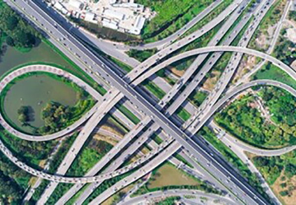 Aerial view of complex motorway interchange showcasing advanced traffic management and logistics solutions by Microlise.