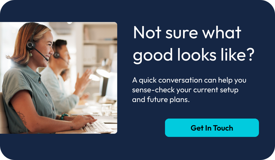 Customer support team member wearing a headset providing assistance at a call centre, representing telematics and fleet management services.