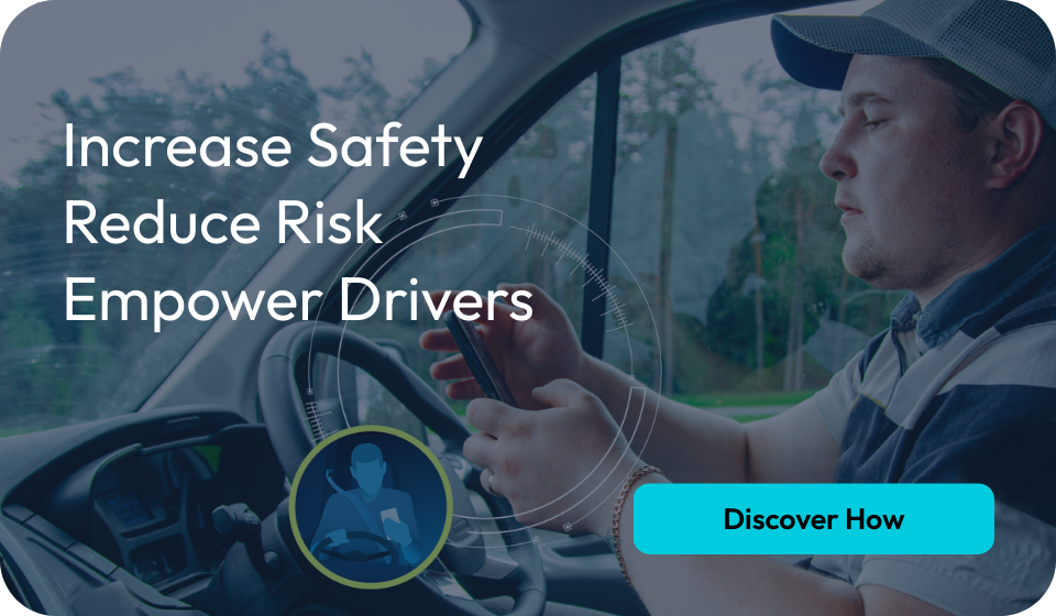 Driver using a mobile device in a commercial vehicle, highlighting enhanced safety and monitoring through Microlise's new partnership with Streamax.