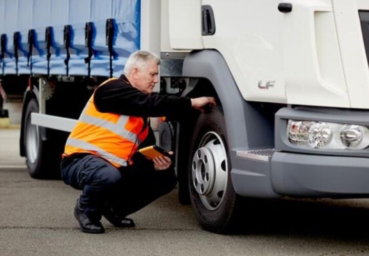 Brake inspection being performed on a large commercial truck, highlighting the importance of vehicle compliance and safety in Australian transport.