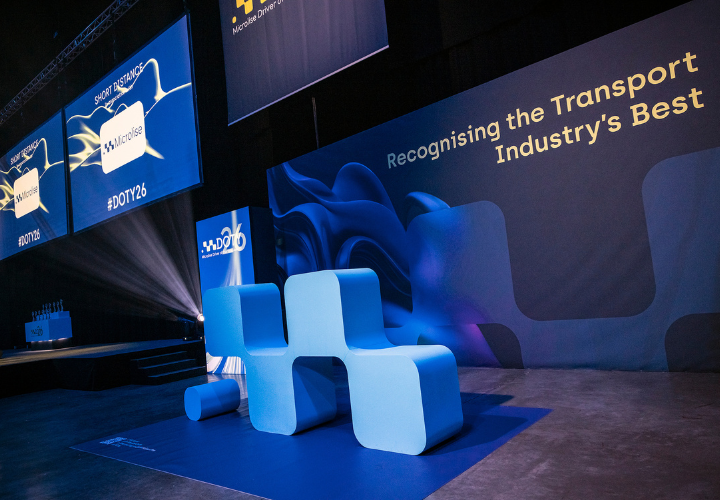 Efficient transport industry event stage with Microlise branding, showcasing logistics and fleet management solutions at a professional conference.